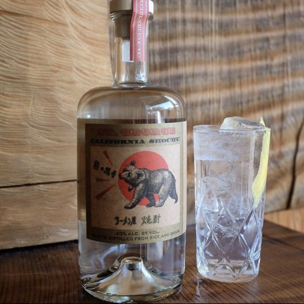 A bottle of shochu and a highball glass