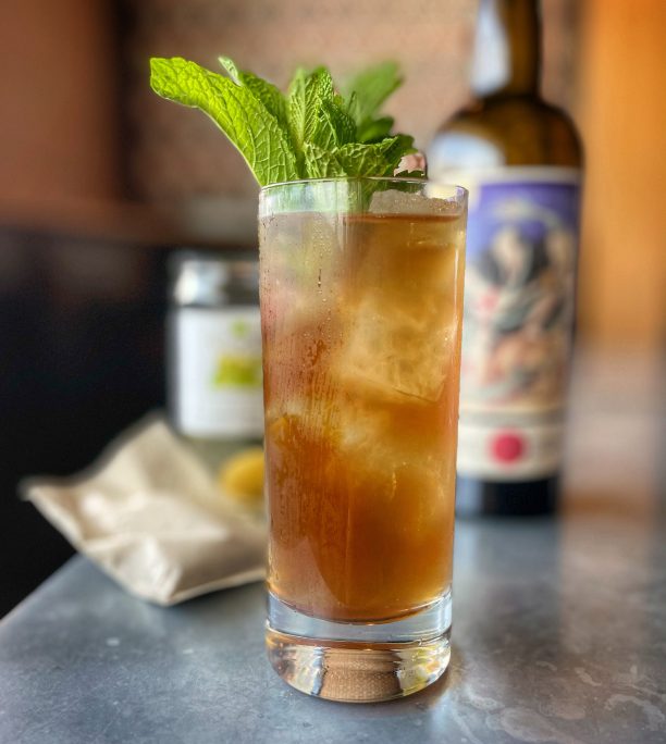 A highball garnished with mint