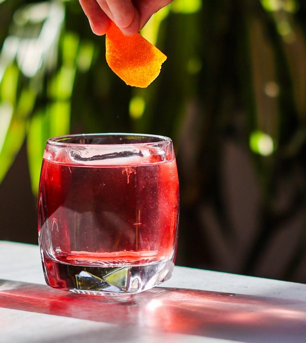 A red drink lit by sun